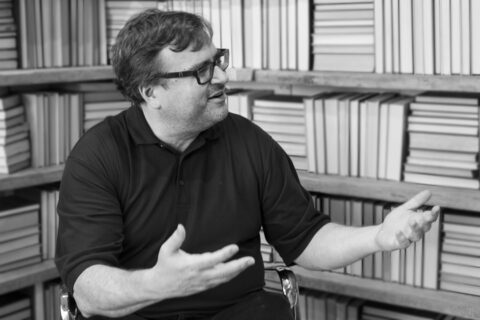 reid-hoffman-books Reid Hoffman in front of shelves of books